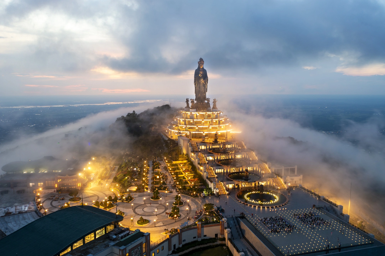 The illuminated Ba Den Mountain complex at twilight, appearing as a glowing jewel (Photo: Collected)